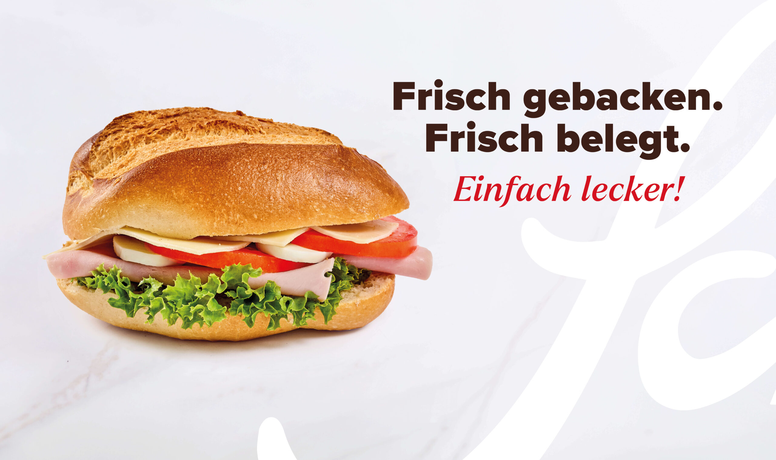 Ein Krusti mit Schinken, Käse, Ei, Tomate und Salat.